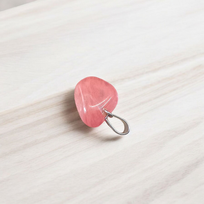 A stunning Rose Quartz Tumble Stone Pendant, lab-certified for authenticity, symbolizing love, healing, and positive energy