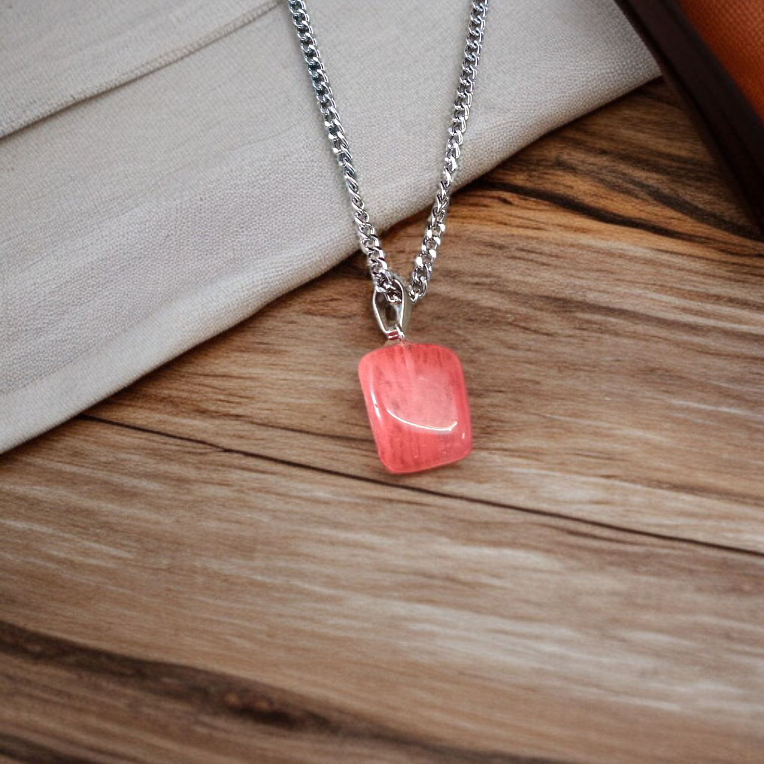 A stunning Rose Quartz Tumble Stone Pendant, lab-certified for authenticity, symbolizing love, healing, and positive energy