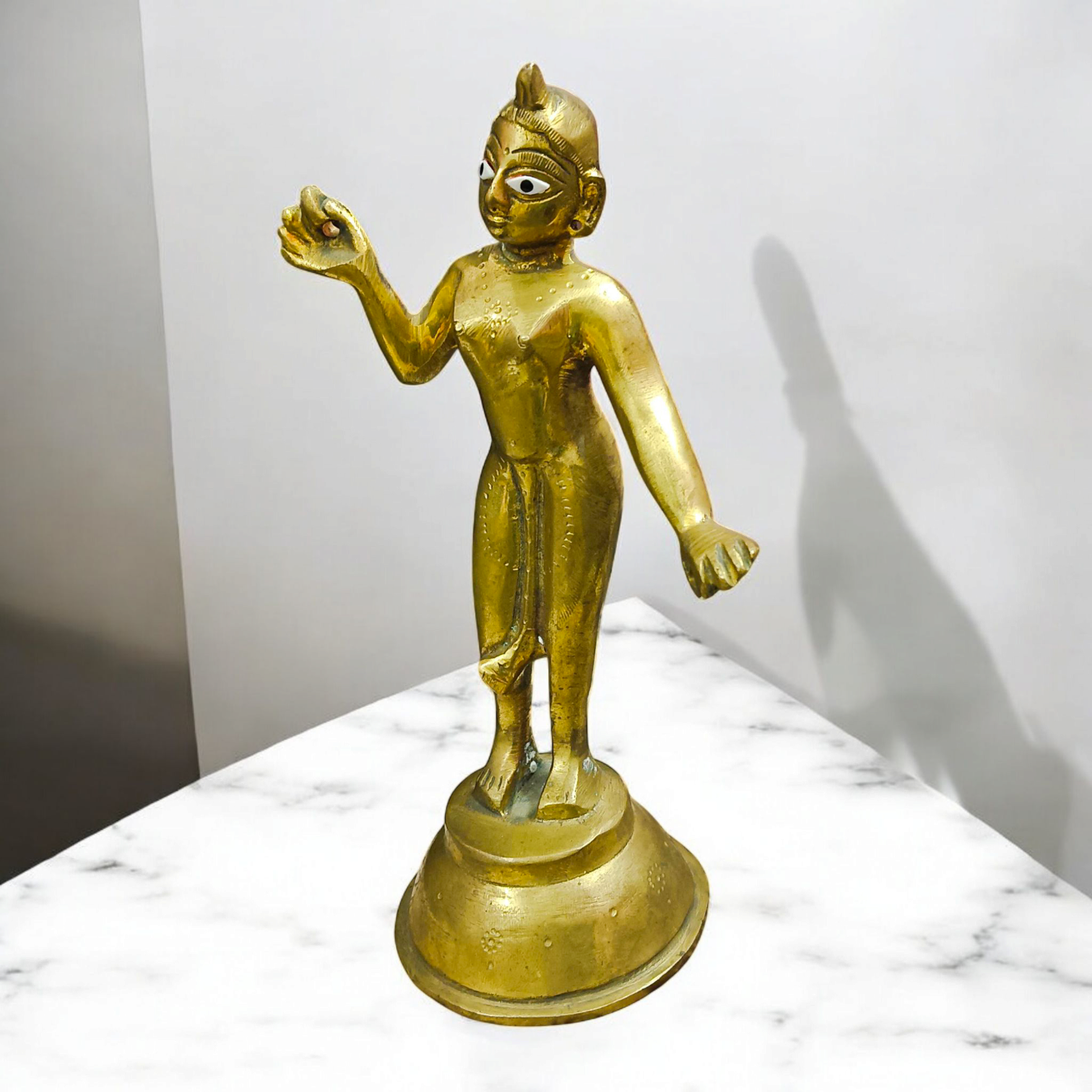 An intricately designed brass statue of Goddess Radha Rani, symbolizing divine love, purity, and devotion, perfect for worship or as a decorative piece.

