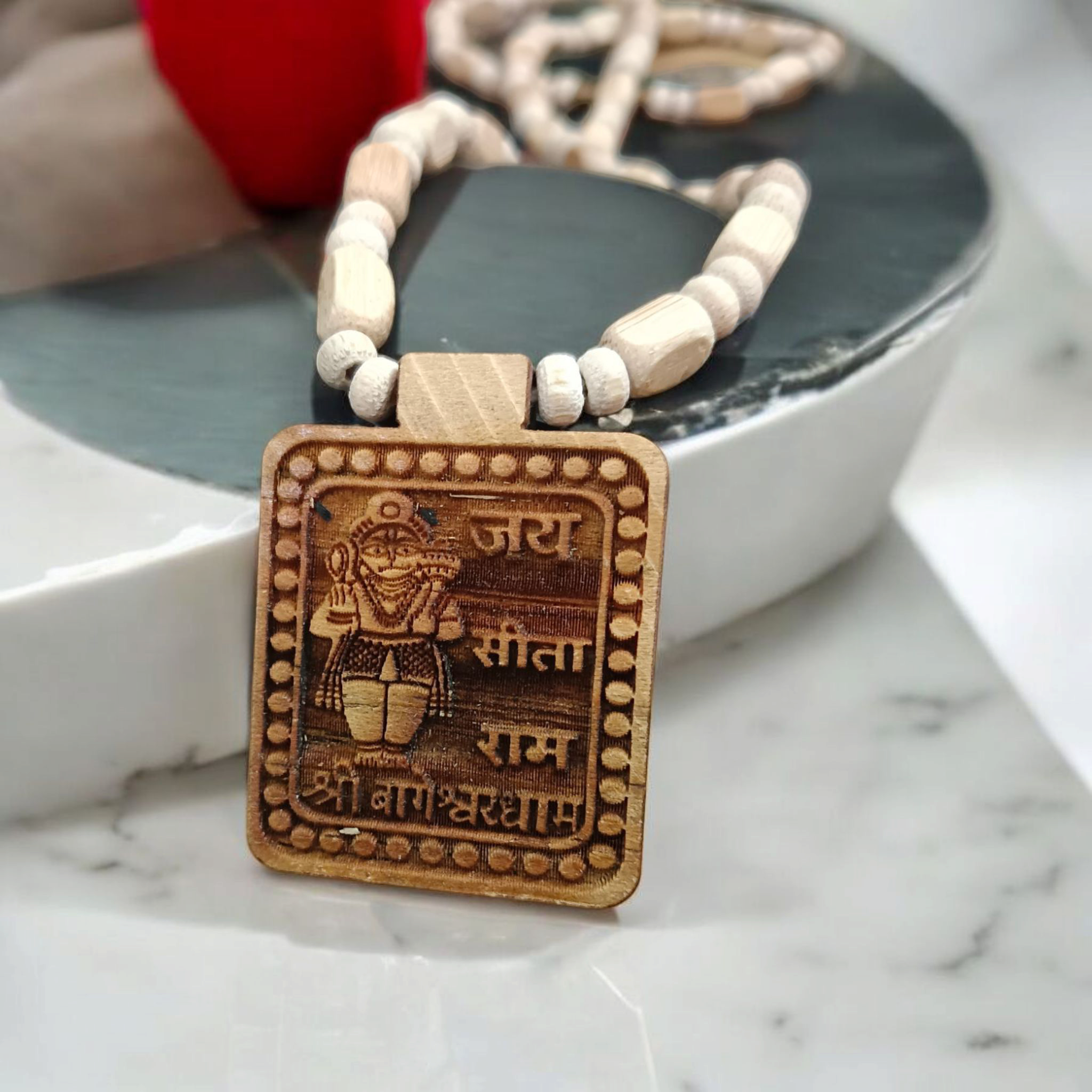 Bageshwar Dham Jai Sita Ram Tulsi Mala, displaying the Tulsi beads and an inscription of Jai Sita Ram