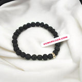 Black 5 Mukhi Rudraksha Bracelet with 7MM beads, lab certified, stretchable design, offering Shiva’s blessings and spiritual growth.