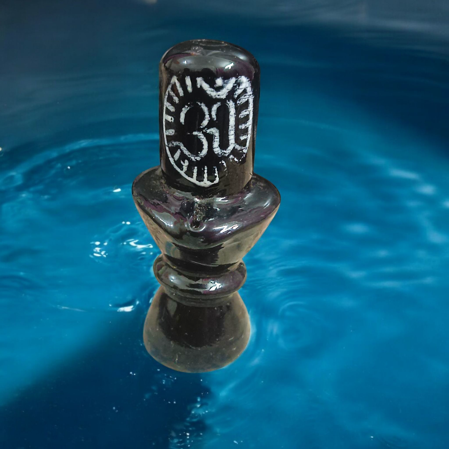 Black Marble Stone Shivling for pooja, worship, and spiritual rituals, representing the divine presence of Lord Shiva.