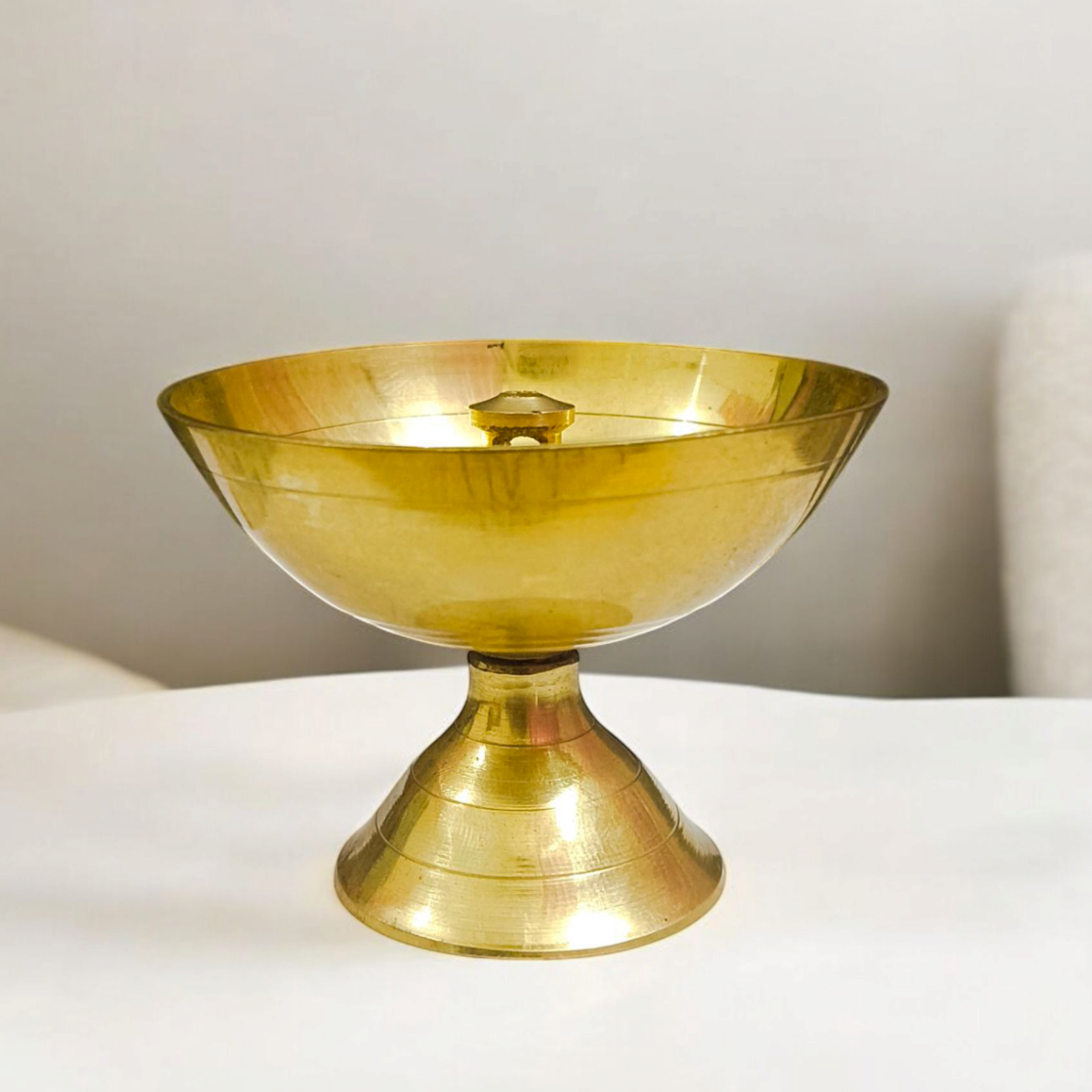 Brass Akhand Jyot diya with heavy base for steady flame, designed for pooja and aarti rituals, creating a spiritual and peaceful environment.