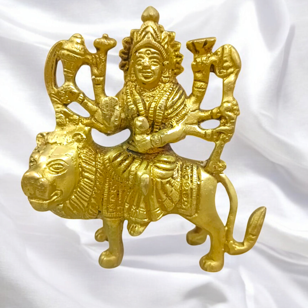 Brass Durga Mata Murti, depicting Goddess Durga on a lion, intricately crafted for worship and spiritual protection.
