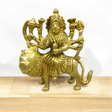 Brass Durga Mata Murti, depicting Goddess Durga on a lion, intricately crafted for worship and spiritual protection.