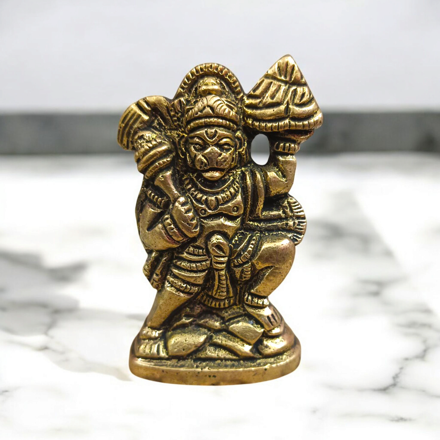 Brass Hanuman Ji Idol carrying the Sanjeevani mountain, symbolizing strength, devotion, and divine protection.