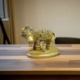 Brass Kamdhenu Cow Murti with calf and deities, ideal for spiritual rituals, pooja, and Vastu correction