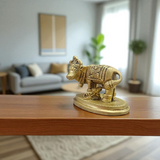 Brass Kamdhenu Cow Murti with calf and deities, ideal for spiritual rituals, pooja, and Vastu correction