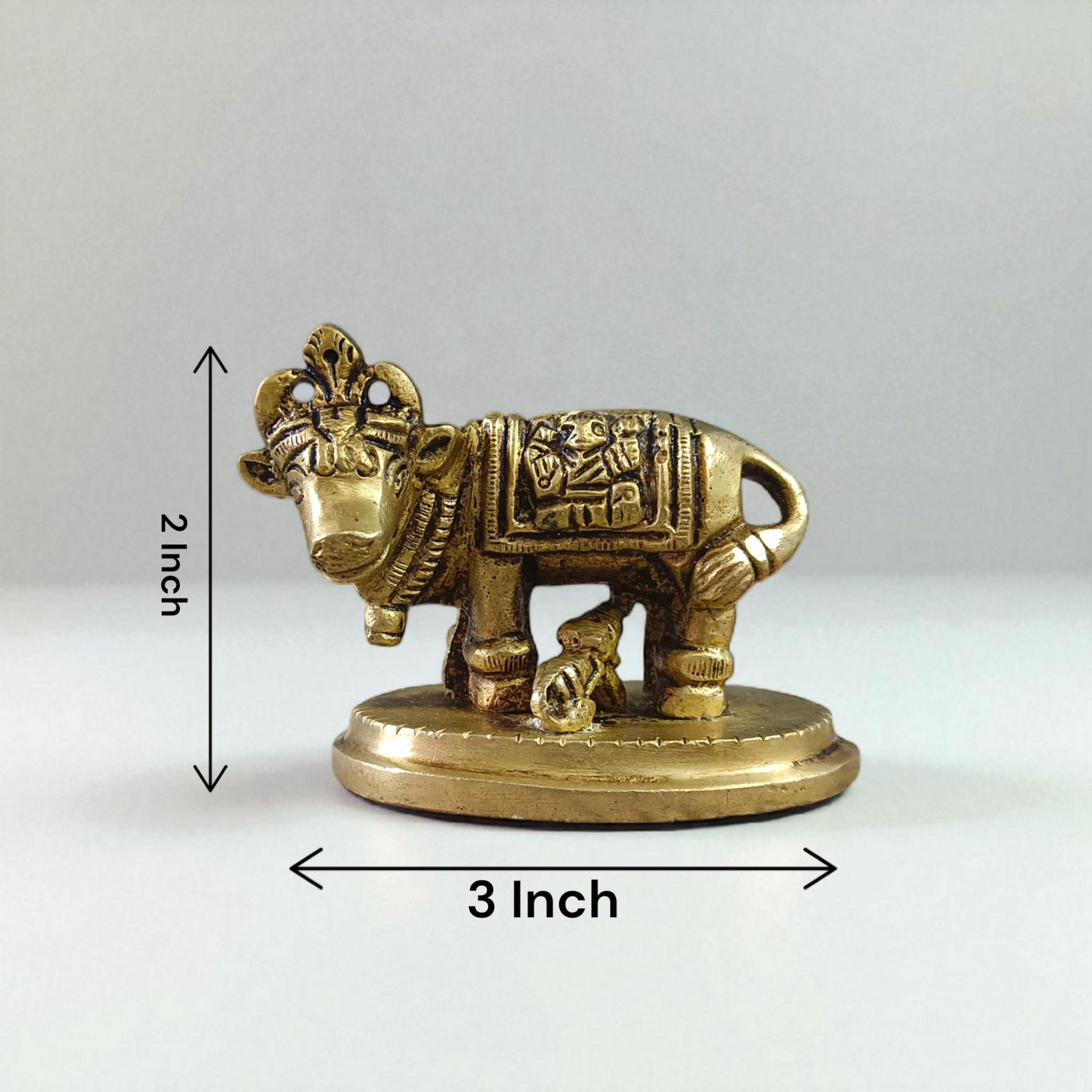 Brass Kamdhenu Cow Murti with calf and deities, ideal for spiritual rituals, pooja, and Vastu correction