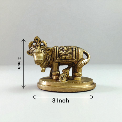 Brass Kamdhenu Cow Murti with calf and deities, ideal for spiritual rituals, pooja, and Vastu correction