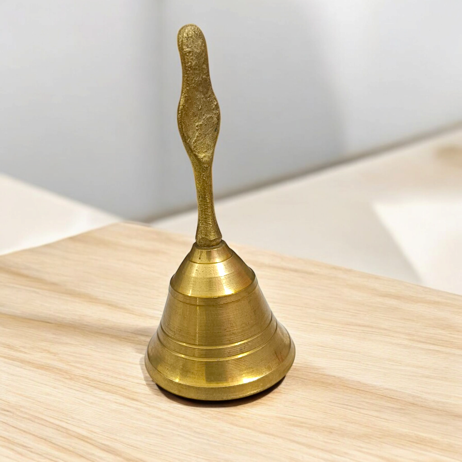 Brass Pooja Bell featuring a Garuda design, perfect for spiritual practices and temple use.