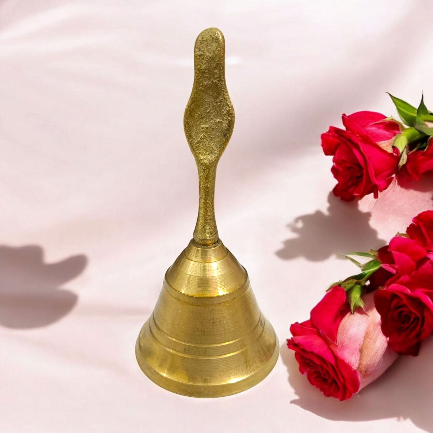 Brass Pooja Bell featuring a Garuda design, perfect for spiritual practices and temple use.