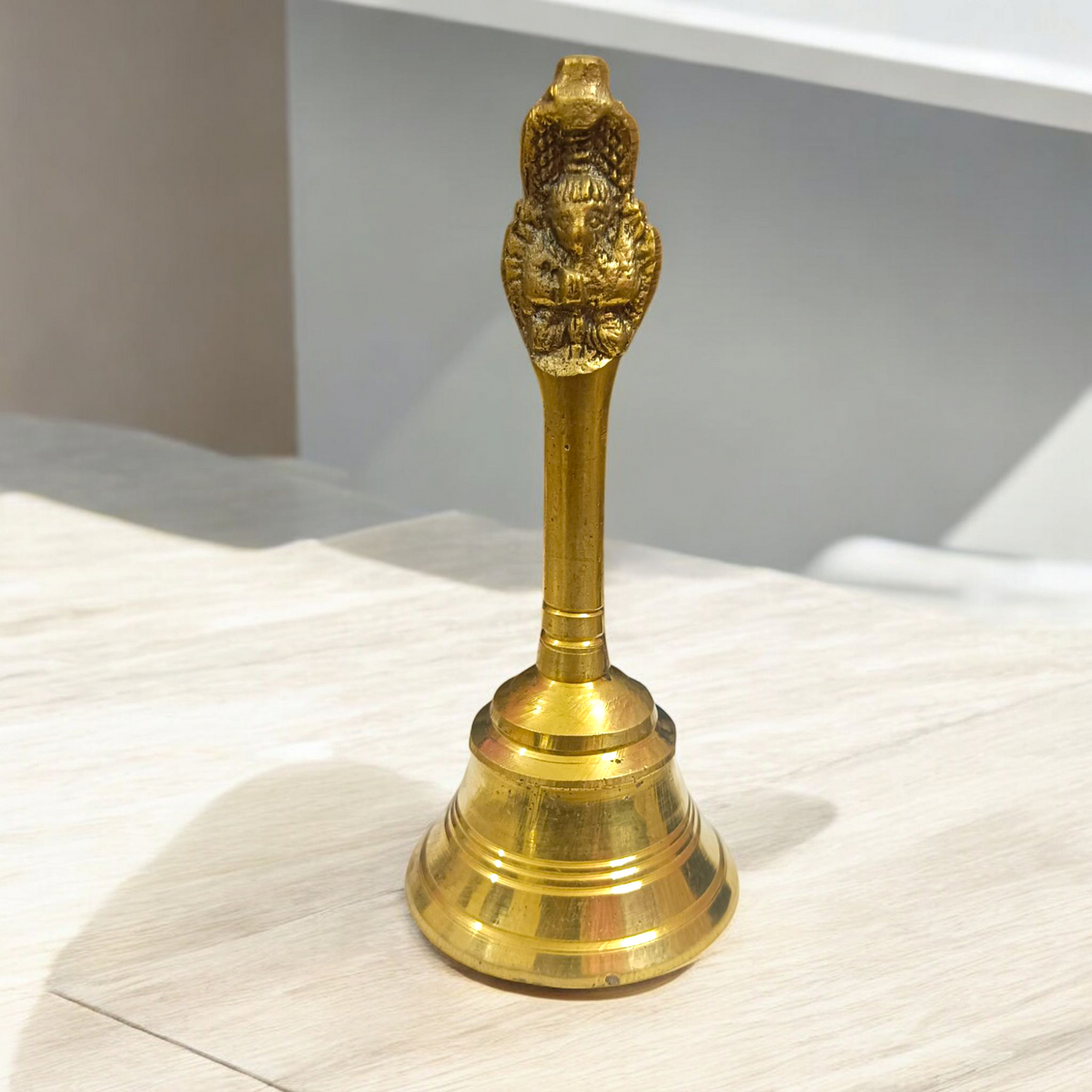  Brass Pooja Bell with a traditional design, perfect for use during temple or home pooja ceremonies.