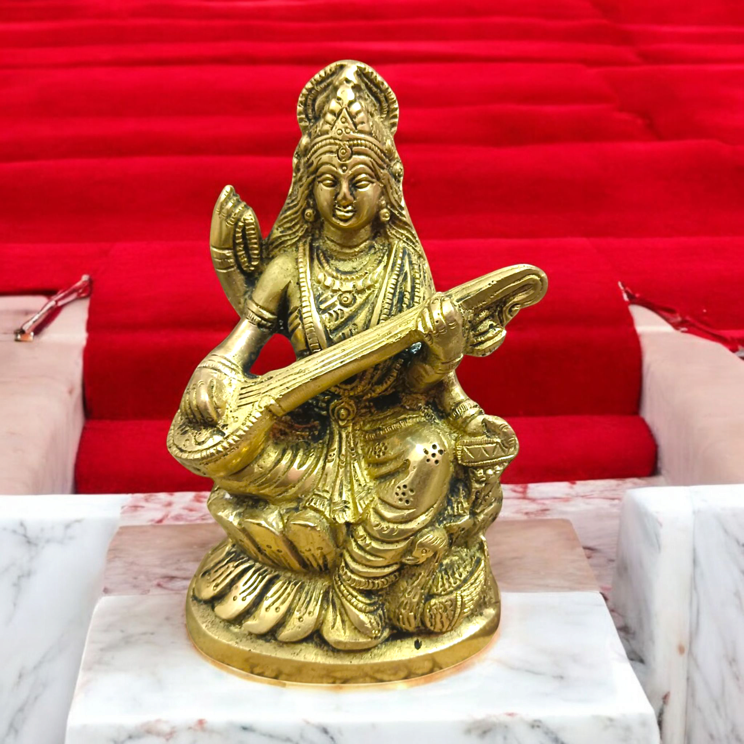 Brass Saraswati Murti Idol, a beautifully detailed statue of Goddess Saraswati, made from brass, with intricate craftsmanship, holding a veena.