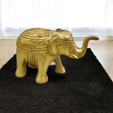 Brass elephant statue symbolizing wisdom, success, and prosperity, intricately crafted for office decor.