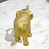 Brass elephant statue symbolizing wisdom, success, and prosperity, intricately crafted for office decor.