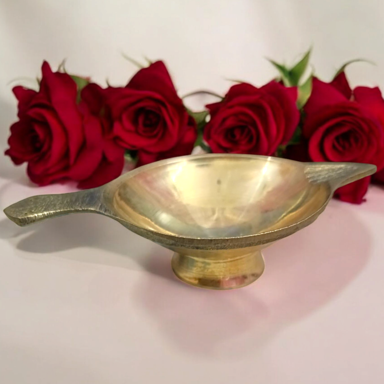 Brass oil lamp (Brass Jyot) designed for pooja rituals, showcasing a steady flame with a traditional and elegant design.