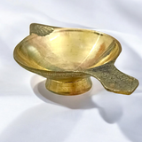 Brass oil lamp (Brass Jyot) designed for pooja rituals, showcasing a steady flame with a traditional and elegant design.