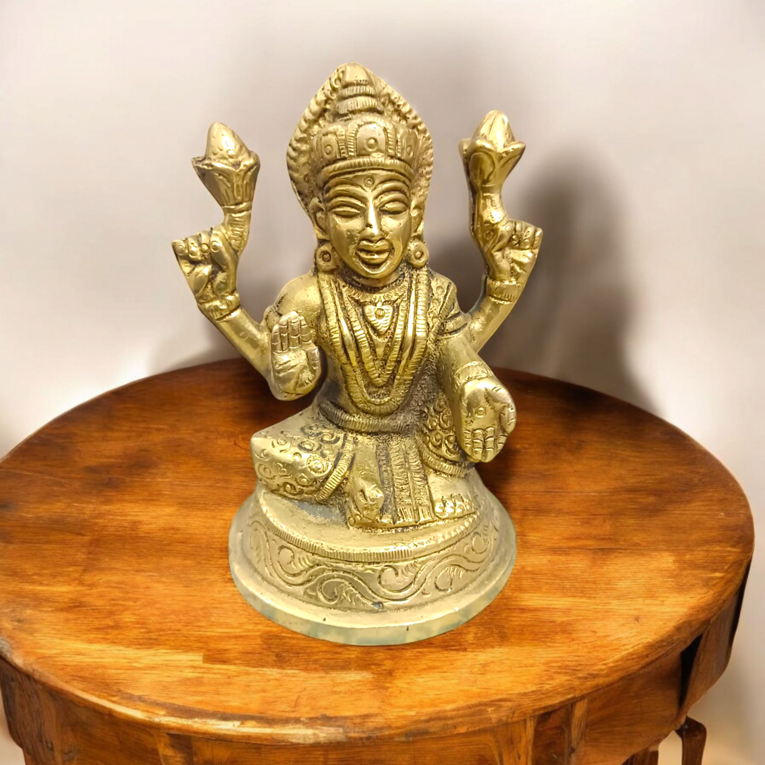 Brass statue of Goddess Lakshmi symbolizing wealth, prosperity, and abundance, finely crafted with intricate details.