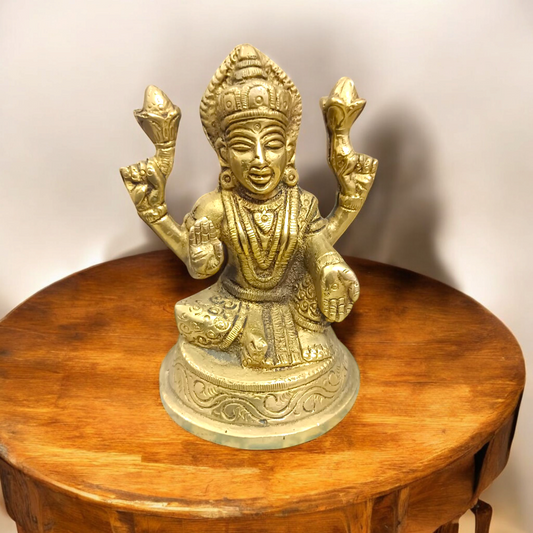 Brass statue of Goddess Lakshmi symbolizing wealth, prosperity, and abundance, finely crafted with intricate details.