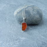 Carnelian Stone Pendant made from raw Carnelian crystal on a chain, designed to boost energy, creativity, and emotional balance.