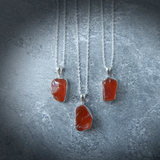 Carnelian Stone Pendant made from raw Carnelian crystal on a chain, designed to boost energy, creativity, and emotional balance.