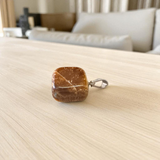 Close-up image of a Tiger Eye Pendant with chain, showcasing the natural golden-brown bands of the stone, ideal for daily wear and spiritual protection