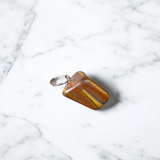 Close-up image of a Tiger Eye Pendant with chain, showcasing the natural golden-brown bands of the stone, ideal for daily wear and spiritual protection