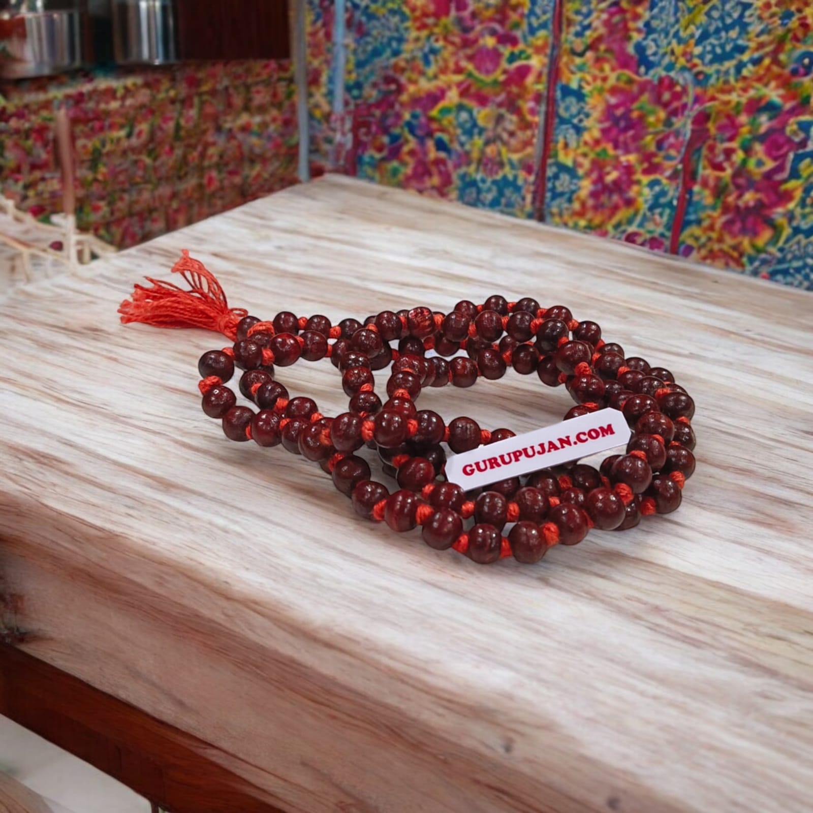 Close-up of Natural Lal Chandan Mala with rich red sandalwood beads used for meditation and spiritual rituals