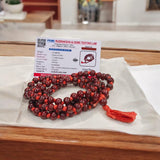 Close-up of Natural Lal Chandan Mala with rich red sandalwood beads used for meditation and spiritual rituals