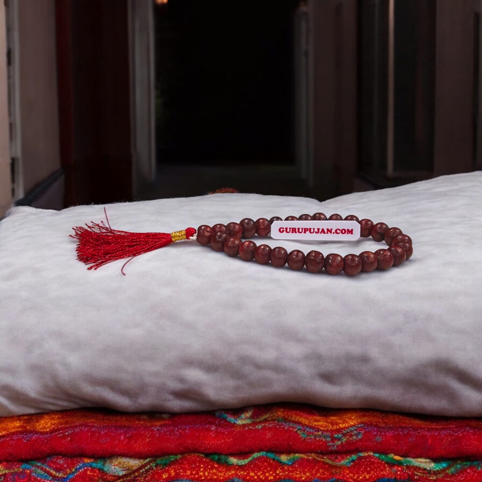 Close-up of Natural Lal Chandan Mala with rich red sandalwood beads used for meditation and spiritual rituals