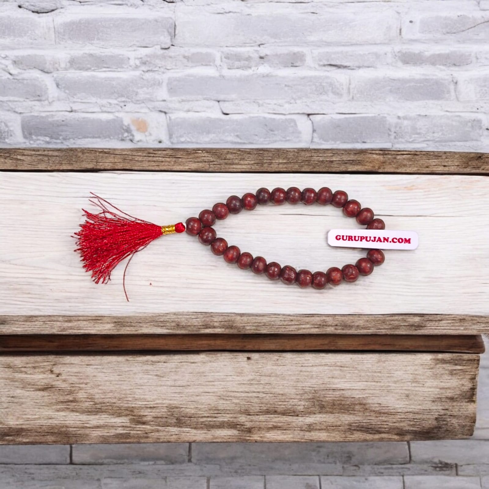 Close-up of Natural Lal Chandan Mala with rich red sandalwood beads used for meditation and spiritual rituals