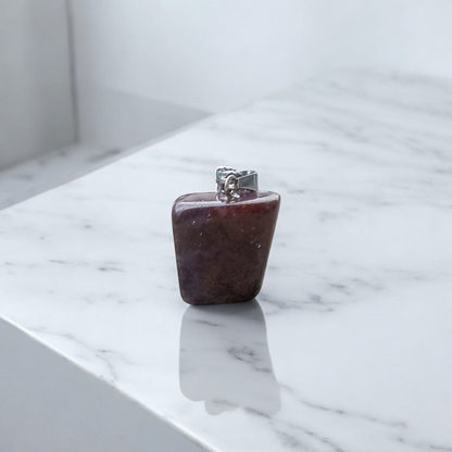 Close-up of lab-certified deep red Almandine Garnet pendant in elegant silver setting, ideal for daily wear and spiritual use