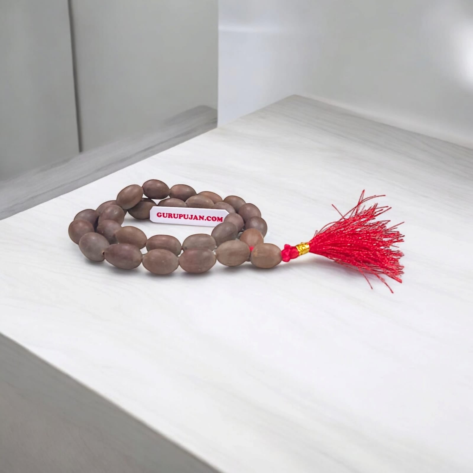 Close-up view of Kamal Gutta Mala (Lotus Seeds Mala) with natural lotus seed beads used for Goddess Lakshmi mantras and wealth attraction