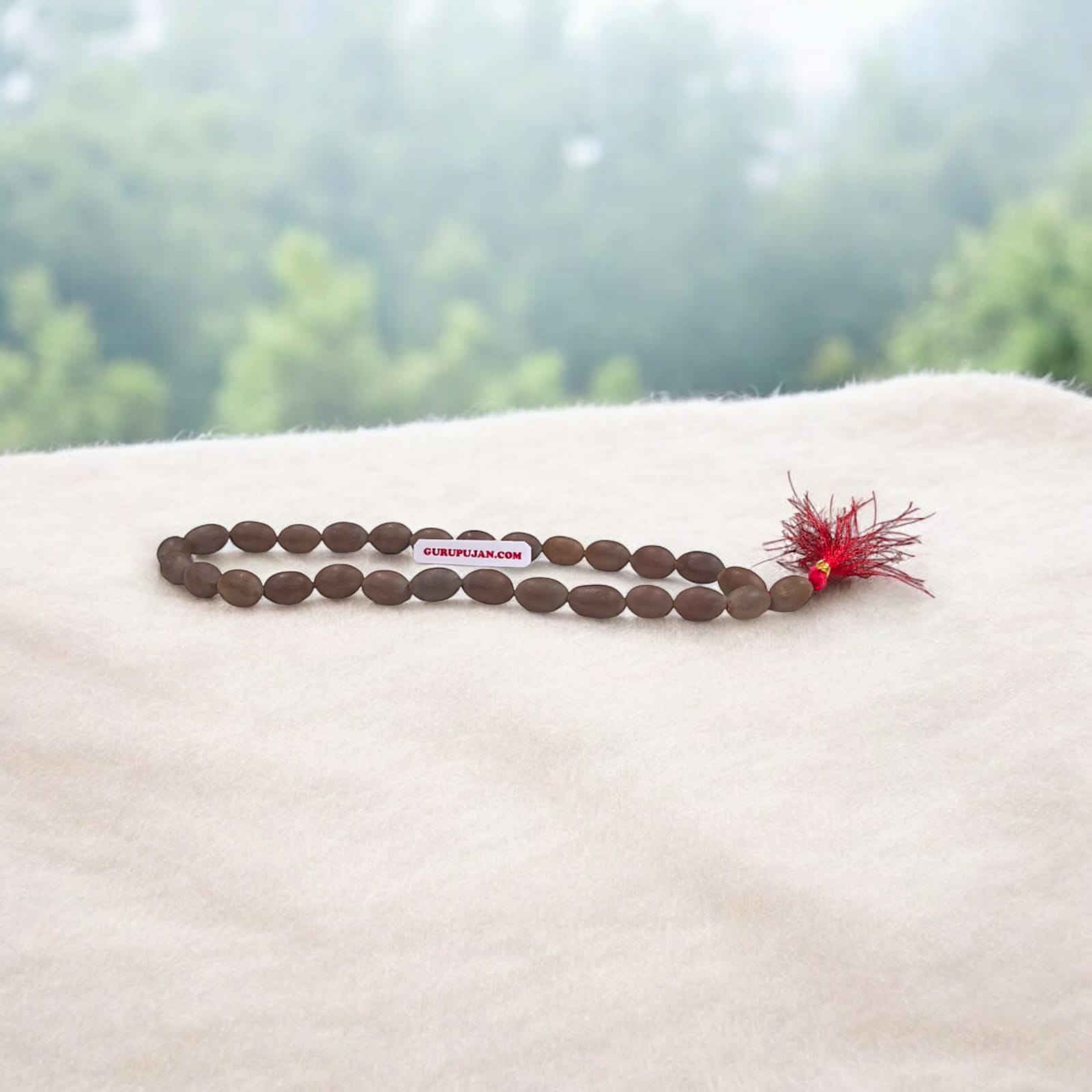 Close-up view of Kamal Gutta Mala (Lotus Seeds Mala) with natural lotus seed beads used for Goddess Lakshmi mantras and wealth attraction