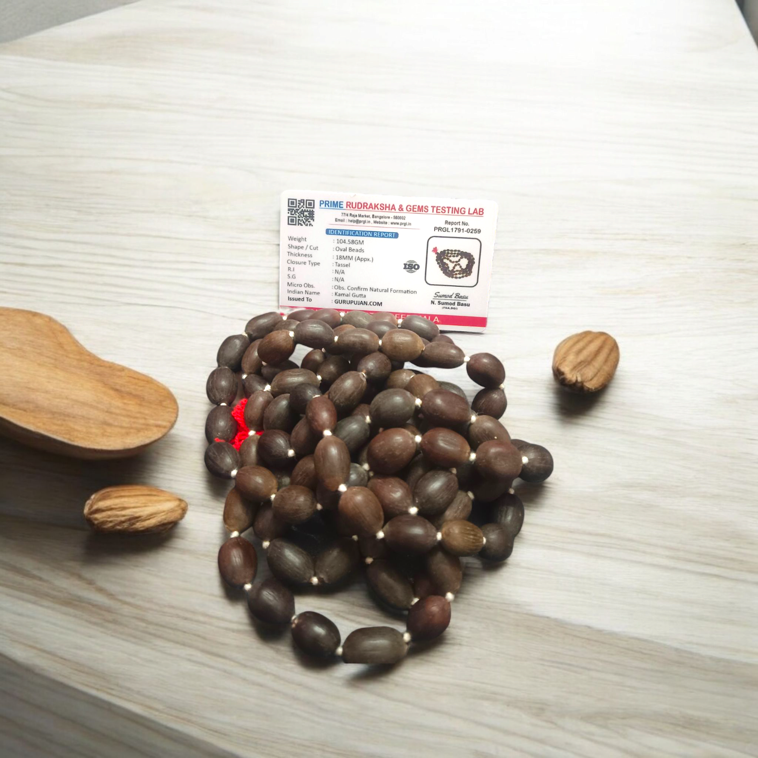 Close-up view of Kamal Gutta Mala (Lotus Seeds Mala) with natural lotus seed beads used for Goddess Lakshmi mantras and wealth attraction