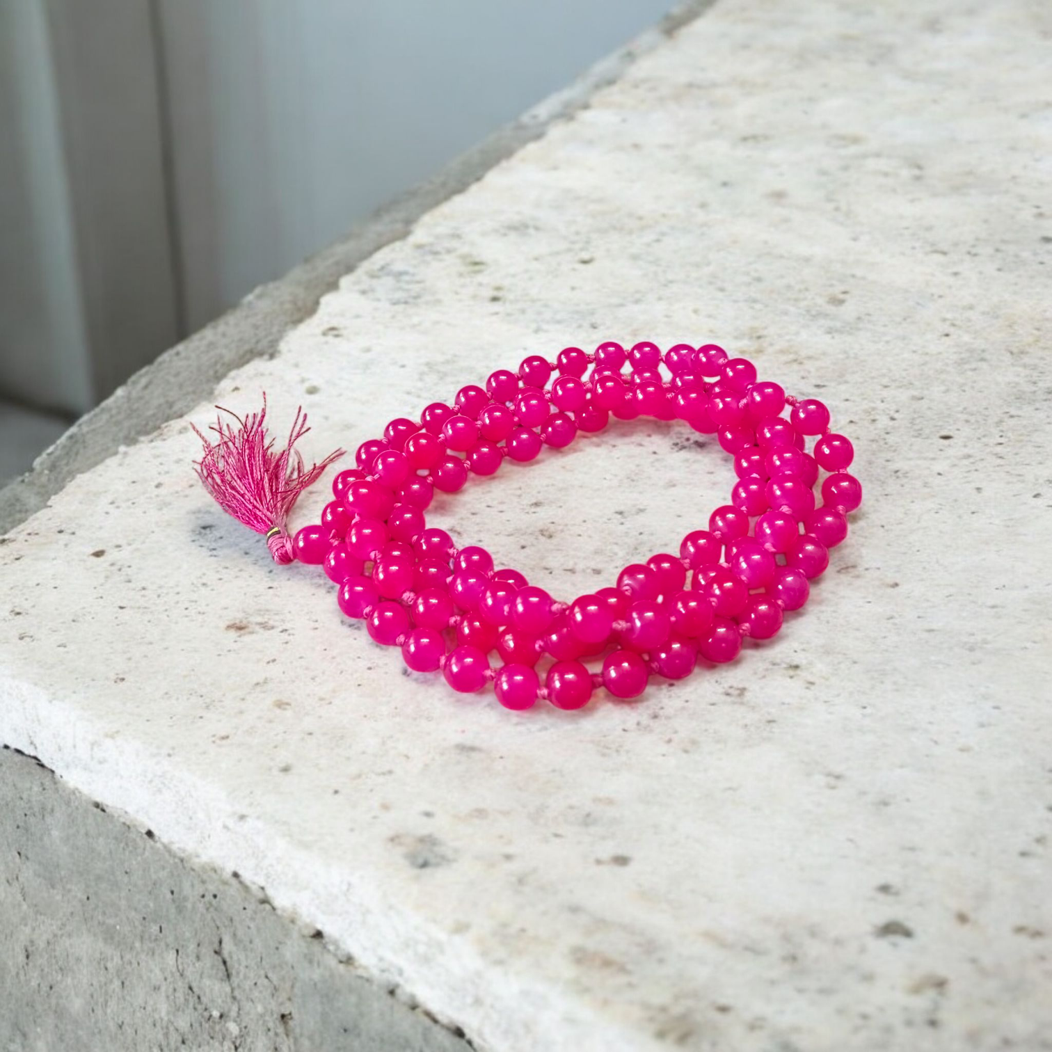 Combo of natural pink agate mala (108+1 beads) and matching bracelet with 6mm beads, used for healing, meditation, and emotional balance