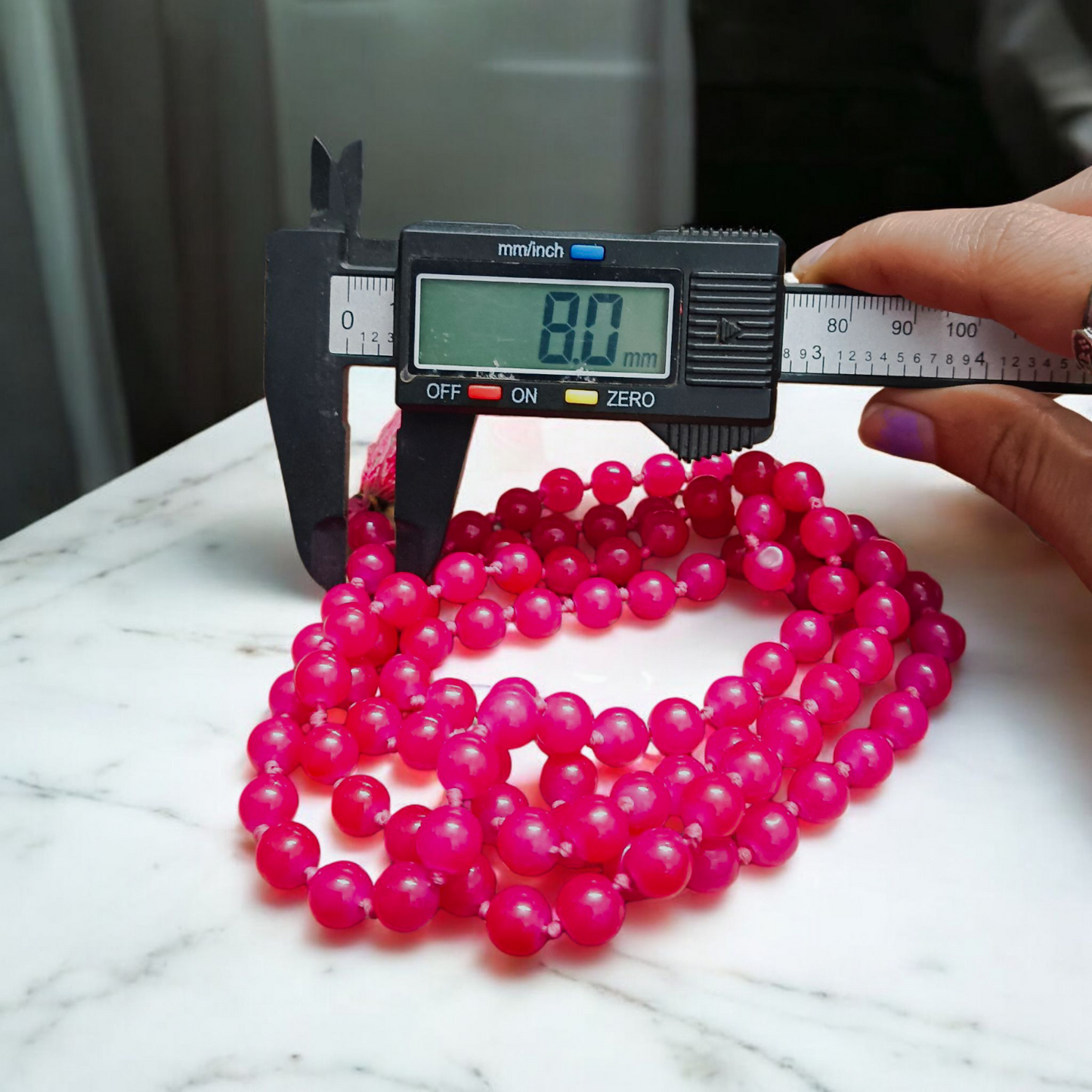 Combo of natural pink agate mala (108+1 beads) and matching bracelet with 6mm beads, used for healing, meditation, and emotional balance