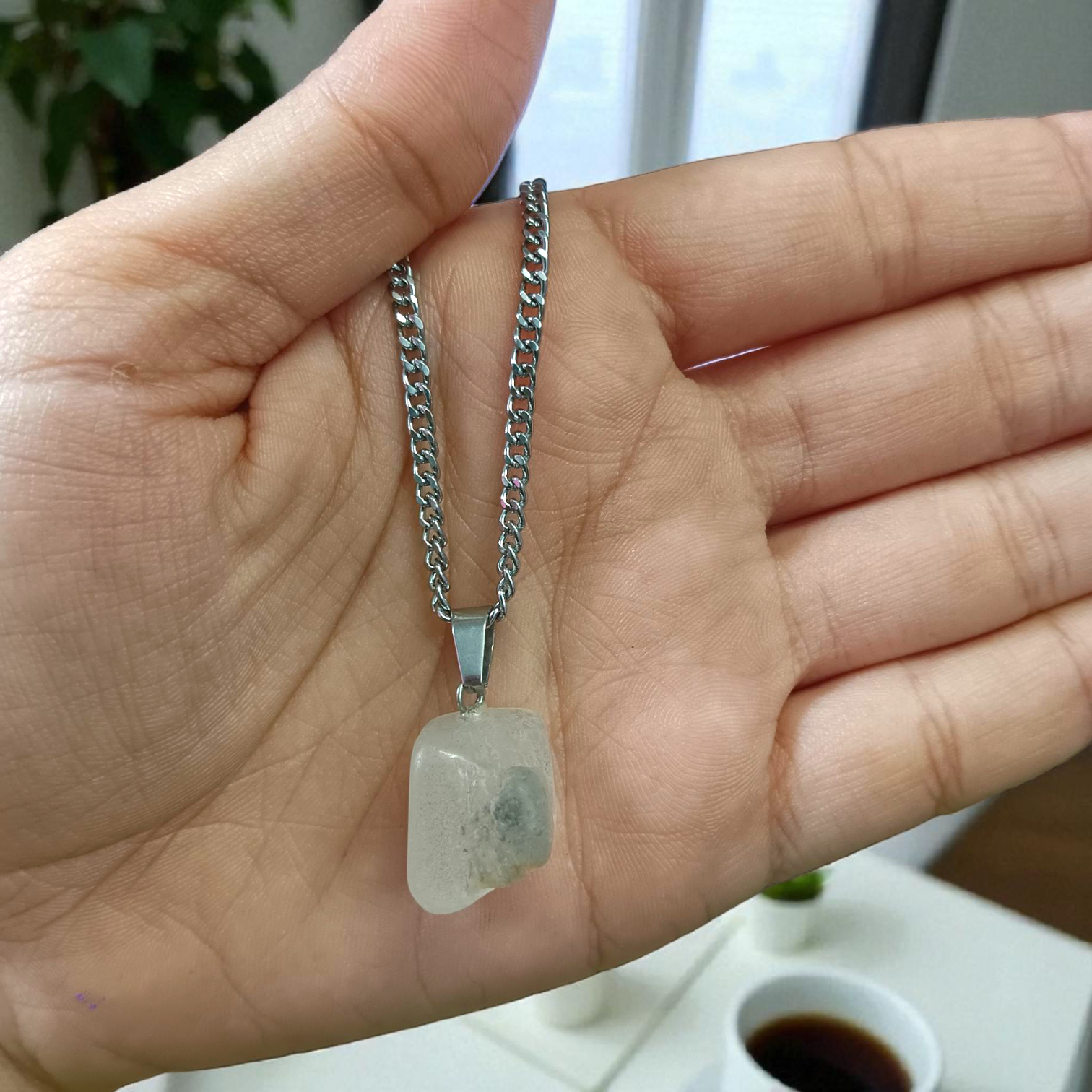 Crystal Quartz Pendant featuring a rough raw stone on a chain, Lab Certified, used for energy amplification, chakra healing, and spiritual growth