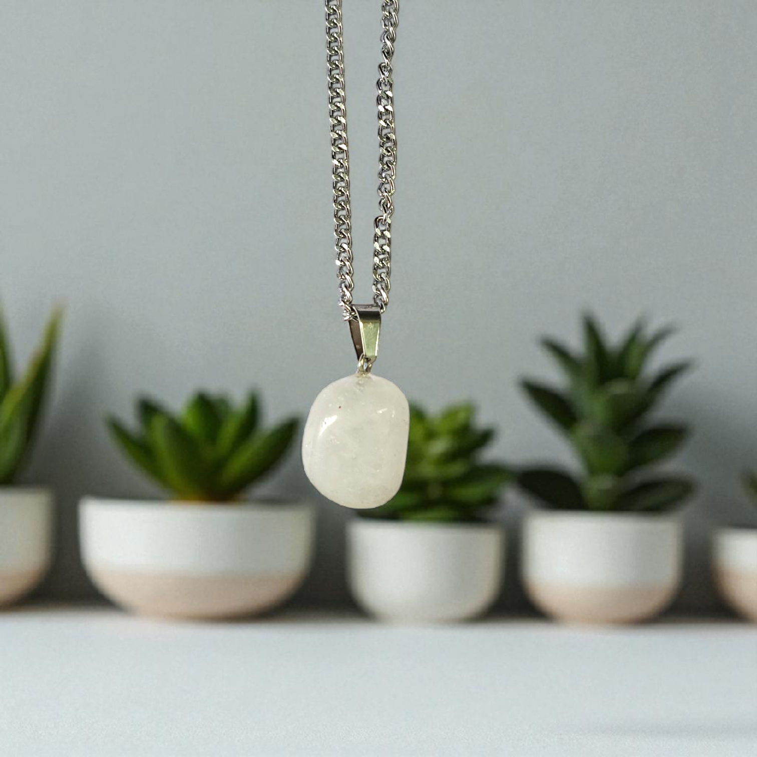 Crystal Quartz Pendant featuring a rough raw stone on a chain, Lab Certified, used for energy amplification, chakra healing, and spiritual growth