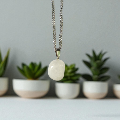 Crystal Quartz Pendant featuring a rough raw stone on a chain, Lab Certified, used for energy amplification, chakra healing, and spiritual growth