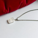 Crystal Quartz Pendant featuring a rough raw stone on a chain, Lab Certified, used for energy amplification, chakra healing, and spiritual growth