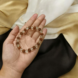Crystal Rudraksha Bracelet with 8MM beads of natural rudraksha and clear quartz, stretchable design, and authenticity certificate for spiritual benefits