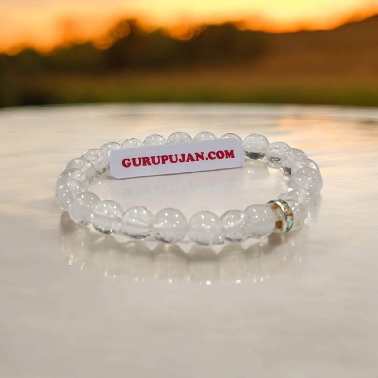 Crystal Sphatik Bracelet with natural transparent 7MM beads, lab certified, stretchable design, promoting peace, clarity, and positive energy.