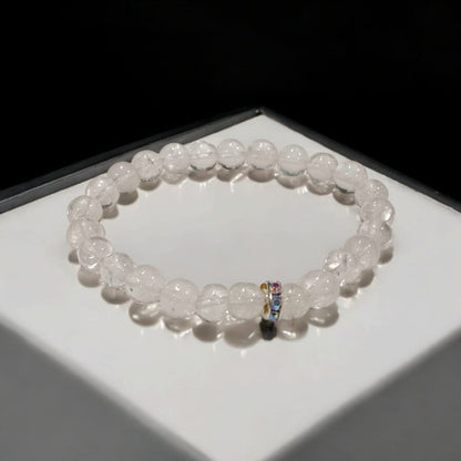 Crystal Sphatik Bracelet with natural transparent 7MM beads, lab certified, stretchable design, promoting peace, clarity, and positive energy.