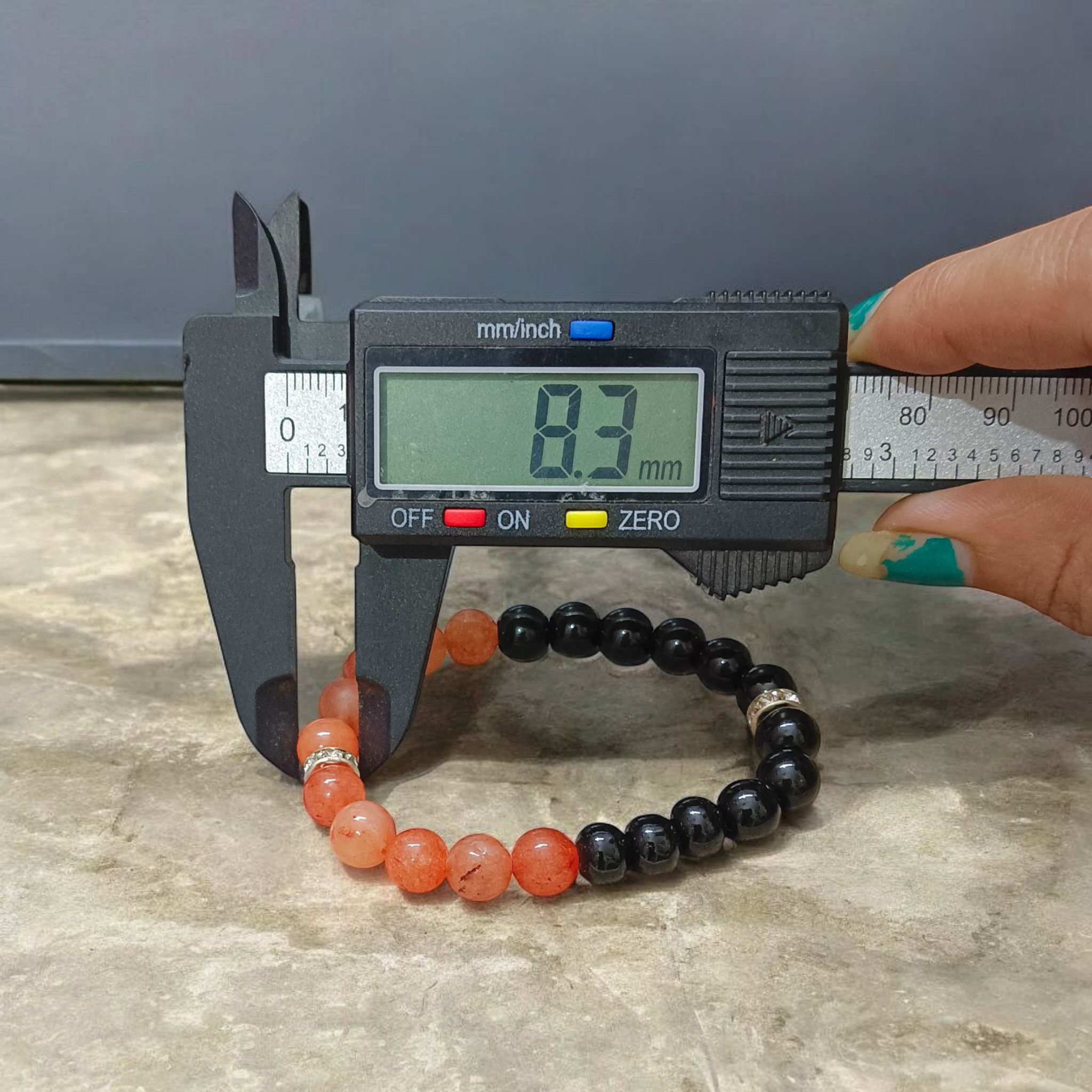 Description of the image: A beautiful Hessonite and Black Agate Bracelet featuring 8MM beads in a stretchable design with natural stones for spiritual healing