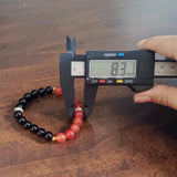Description of the image: A beautiful Hessonite and Black Agate Bracelet featuring 8MM beads in a stretchable design with natural stones for spiritual healing