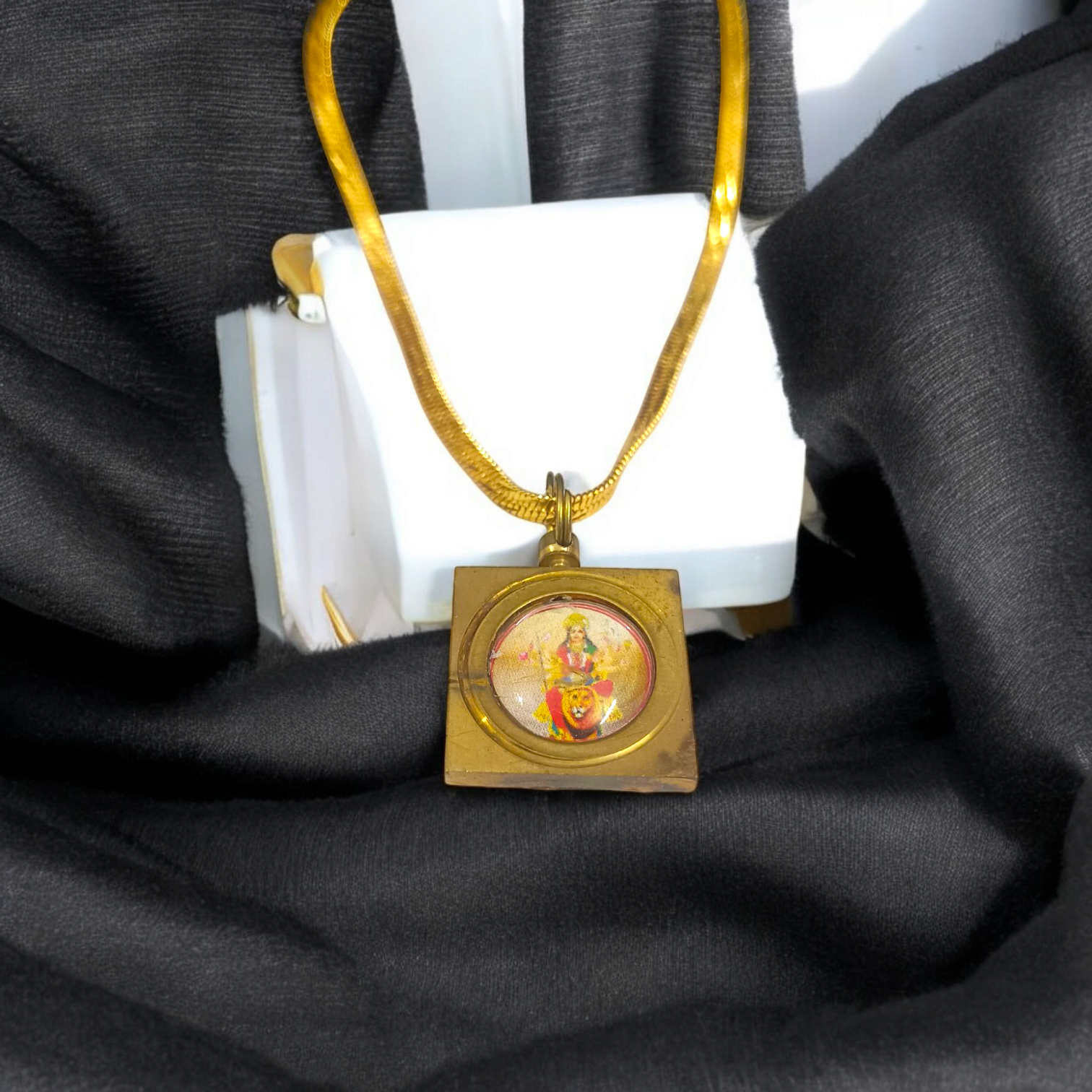 Durga Beesa Locket with gold-plated chain, engraved with the Durga Beesa mantra, offering spiritual protection and divine blessings.