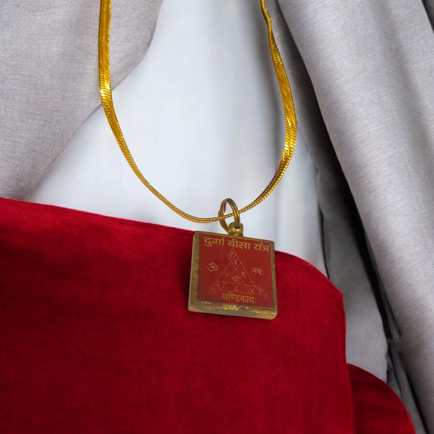 Durga Beesa Locket with gold-plated chain, engraved with the Durga Beesa mantra, offering spiritual protection and divine blessings.