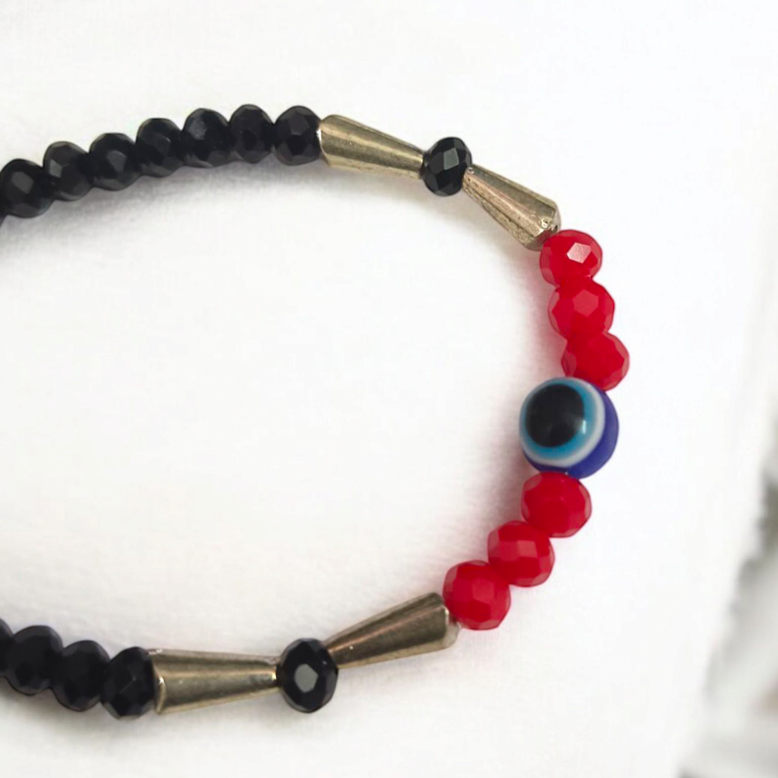 Evil Eye Anklet for Kids with black and red beads, designed for spiritual protection and good luck.